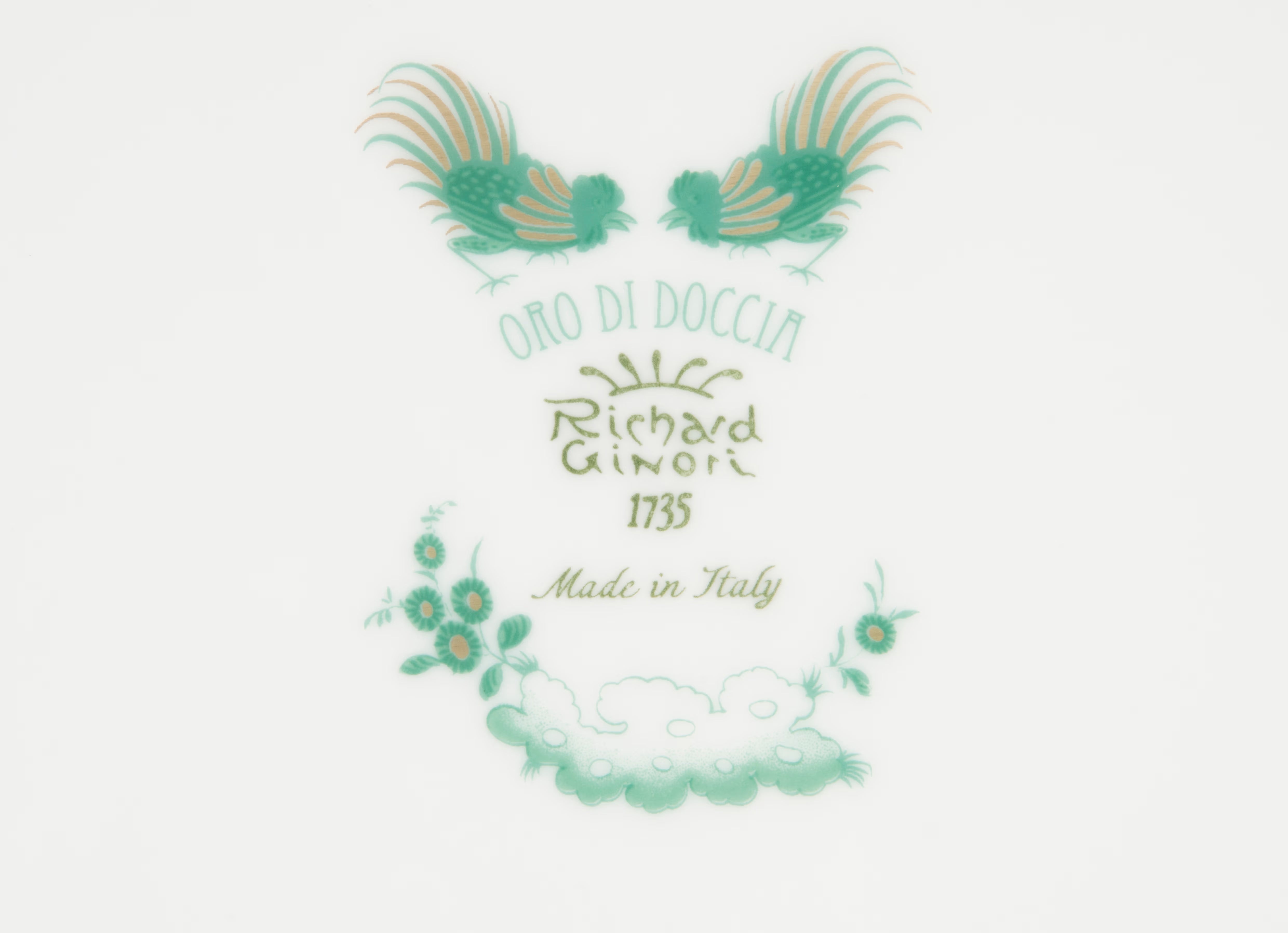 GIADA Decorative logo with rooster illustrations and floral elements on a white background. "Ginori 1735 Is Luxury Tableware Brand And Also Great For Designer Home Gifts"