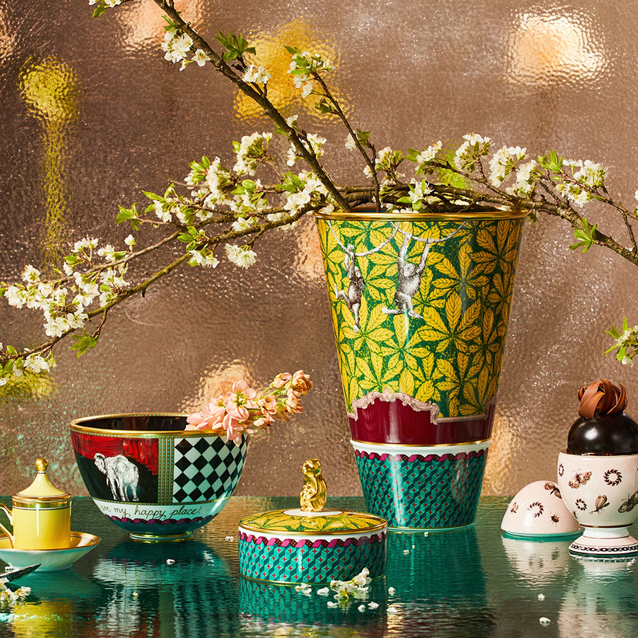 Monkey Vase: With vibrant leaves, geometric patterning, and playful monkeys swinging from vine to vine, the rich coloring makes for a striking presentation on any table or display cabinet. Representing the spirit of playfulness and curiosity, the Monkey design sparks intrigue and creativity. With its whimsical design, it's an excellent choice for those who appreciate the joy of exploration and discovery.