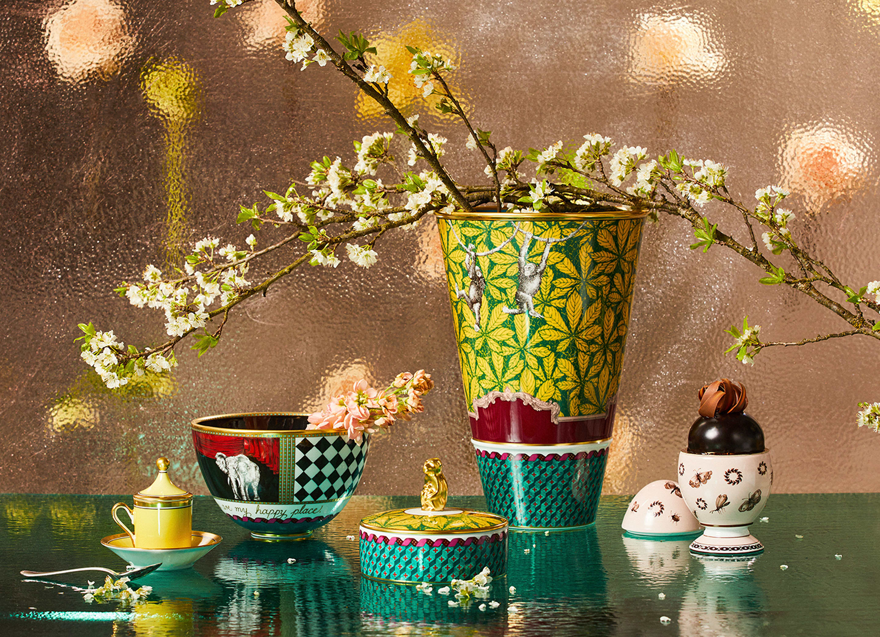 Monkey Vase: With vibrant leaves, geometric patterning, and playful monkeys swinging from vine to vine, the rich coloring makes for a striking presentation on any table or display cabinet. Representing the spirit of playfulness and curiosity, the Monkey design sparks intrigue and creativity. With its whimsical design, it's an excellent choice for those who appreciate the joy of exploration and discovery.