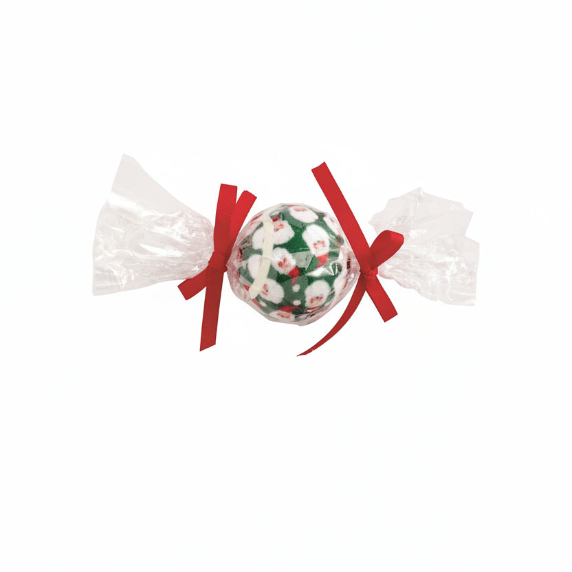 Three Christmas-themed tennis balls in clear wrappers with red, green, and floral designs on a white background.