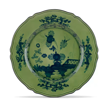Elevate your dining experience with the exquisite Oriente Italiano Collection Porcelain MALACHITE Charger Plate, a masterpiece from Ginori 1735. This luxurious charger plate is meticulously crafted from fine white porcelain, offering a canvas for intricate artistry. The delicate floral ornamentation, hand-painted in pure gold, traces the classic lines of the Antico Doccia pattern, a signature of the esteemed Florentine Maison.