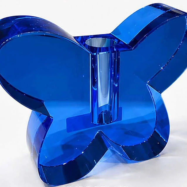 Smokey Blue butterfly-shaped object on a white background