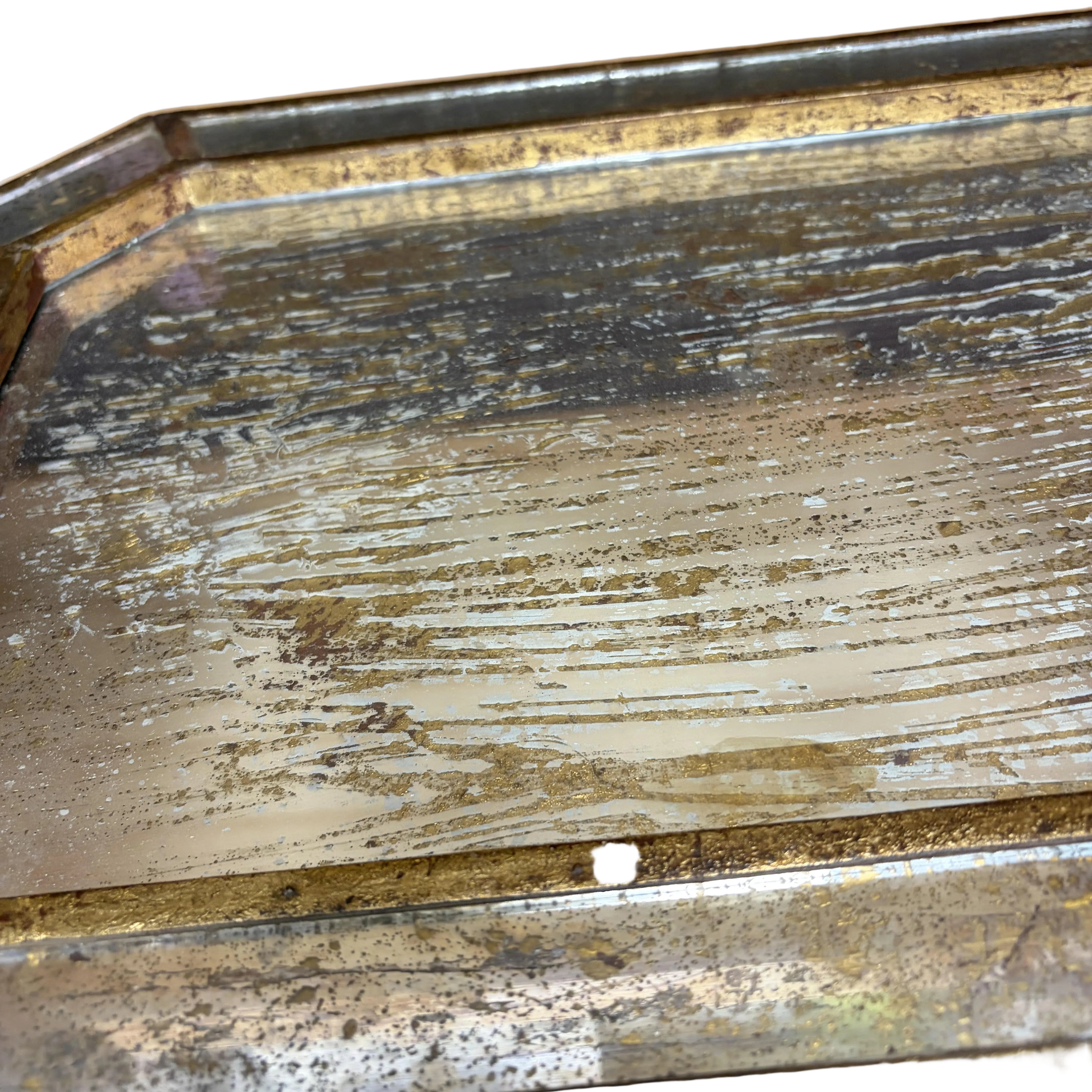 Close-up of a decorative wooden surface with visible wear and tear