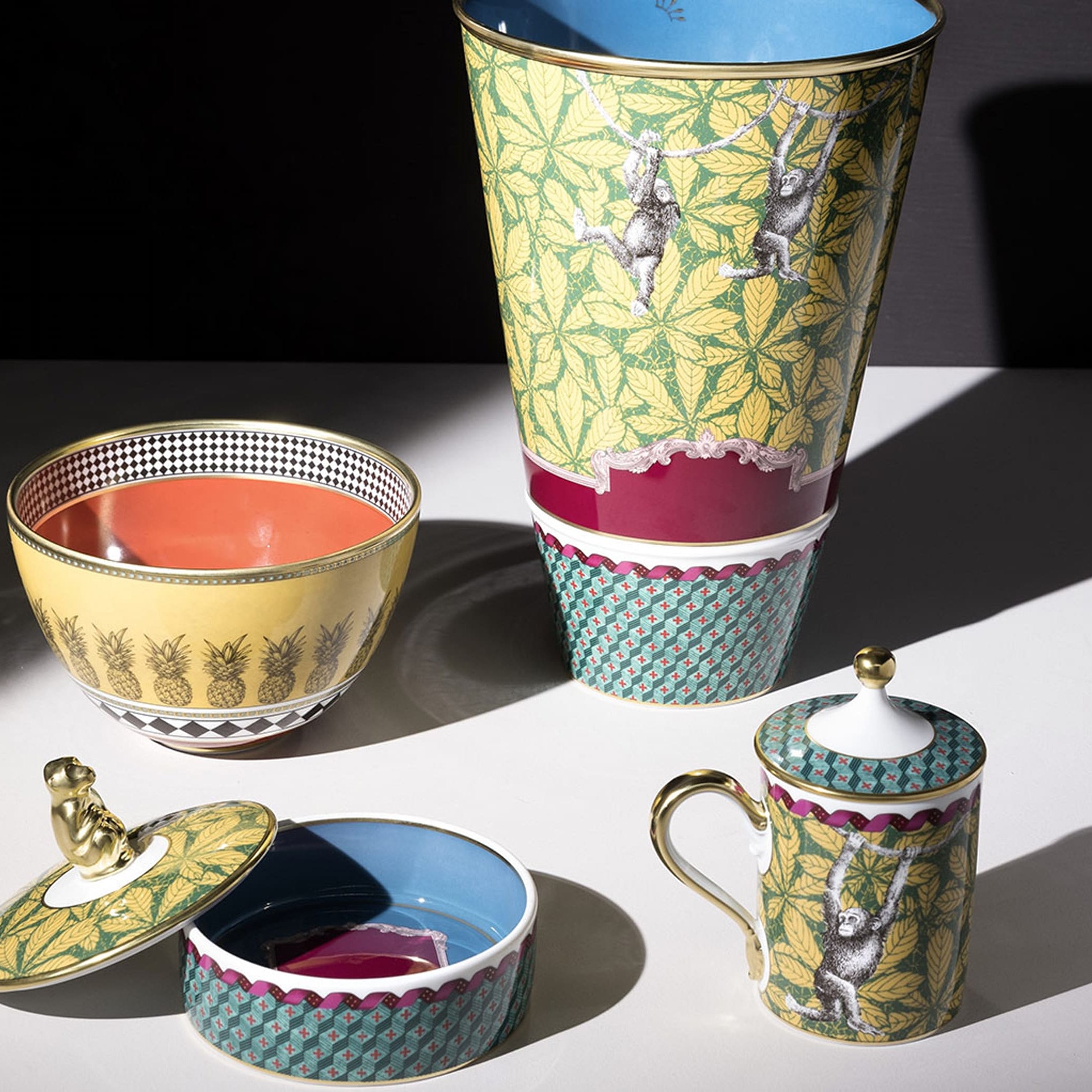 Monkey Vase: With vibrant leaves, geometric patterning, and playful monkeys swinging from vine to vine, the rich coloring makes for a striking presentation on any table or display cabinet. Representing the spirit of playfulness and curiosity, the Monkey design sparks intrigue and creativity. With its whimsical design, it's an excellent choice for those who appreciate the joy of exploration and discovery.