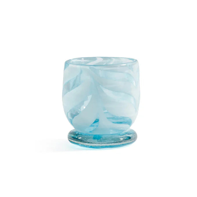 Bring warmth and artistry to your home with the Venezia Aqua Blue Tealight / Votive Holder by Zodax. Expertly crafted from 100% soda lime glass, this elegant candle holder features rich, swirling colors that beautifully diffuse candlelight, creating a soft, inviting glow