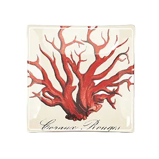 Discover the artistry of the Red Coral Decoupage Glass Tray, an 8" x 8" masterpiece handcrafted in our New York studio, embodying the elegance of the French decoupage tradition. The tray features a striking red coral illustration, a testament to Ben's distinctive eye for the captivating and unique. Each piece is meticulously handcrafted and individually signed by Ben, ensuring that no two trays are exactly alike.