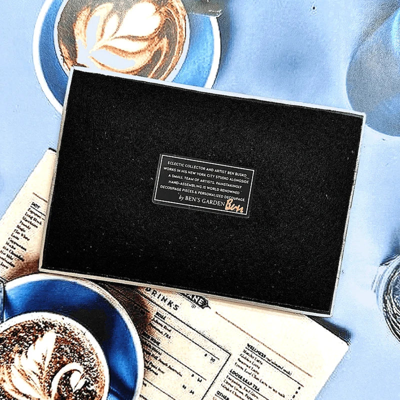 In the French tradition of decoupage, these bent-glass trays are handcrafted in our New York Studio. They feature vintage typeset on a natural cream background, and each is individually signed by Ben. Both practical and charming, Ben's signature decoupage is all food safe, wipe clean and the back side is felted.