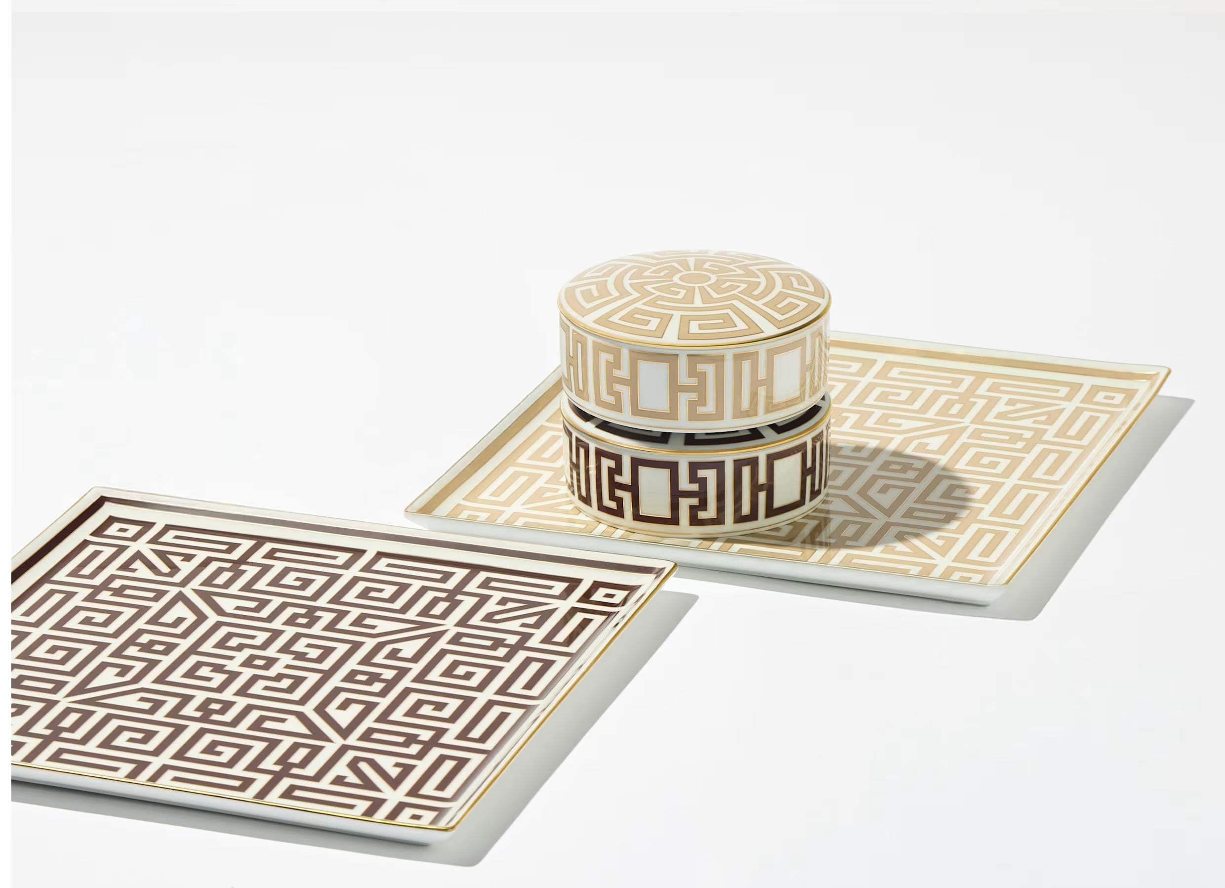 Luxury White Container With Gold Geometric Pattern. Ceramic tray with geometric pattern and matching cylindrical container on a white background
