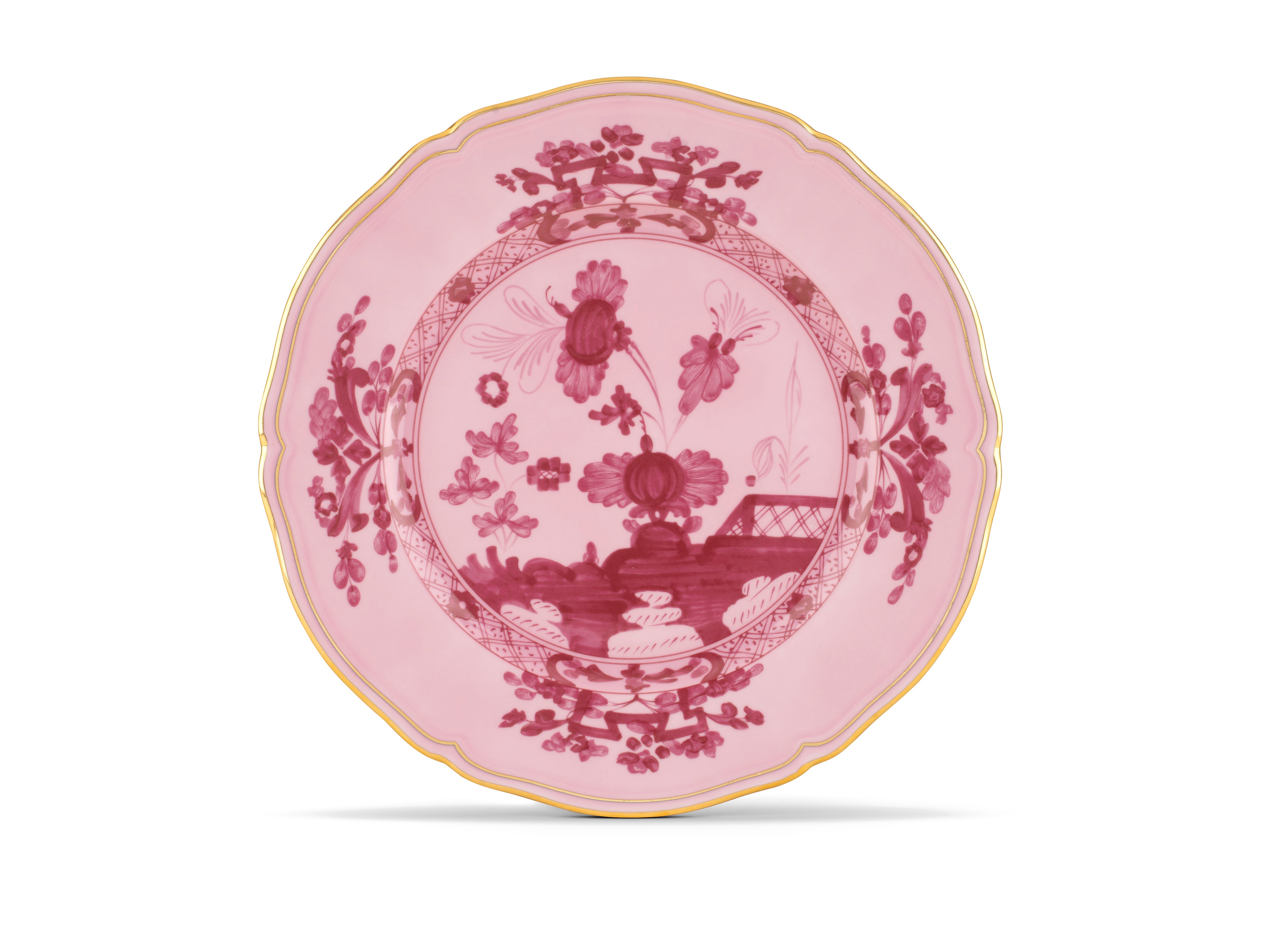 Elevate your dining experience with the exquisite Oriente Italiano Collection Porcelain  PORPORA Charger Plate, a masterpiece from Ginori 1735. This luxurious charger plate is meticulously crafted from fine white porcelain, offering a canvas for intricate artistry. The delicate floral ornamentation, hand-painted in pure gold, traces the classic lines of the Antico Doccia pattern, a signature of the esteemed Florentine Maison.