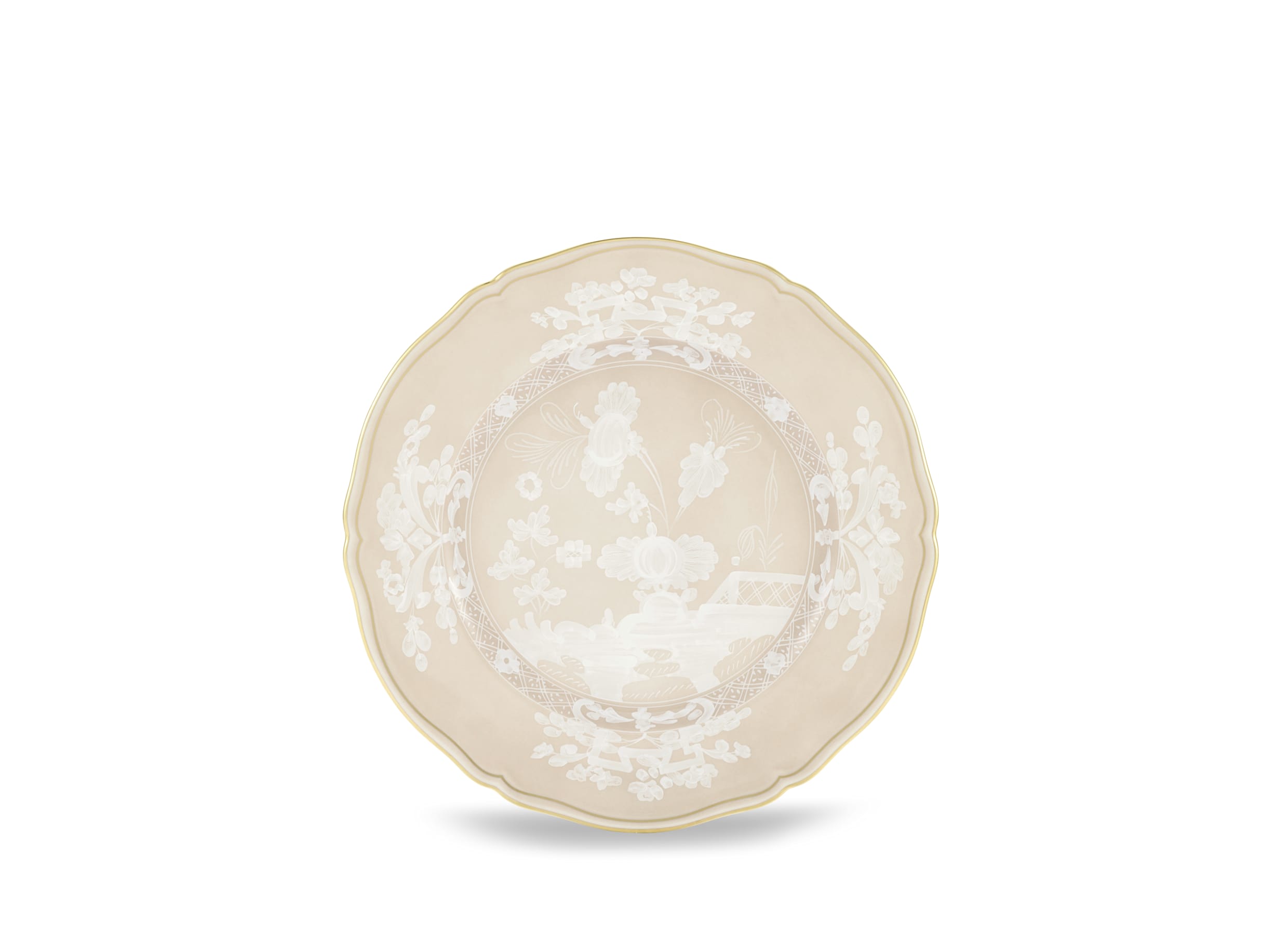 Elevate your dining experience with the exquisite Oriente Italiano Collection Porcelain MEREBGUE  Charger Plate, a masterpiece from Ginori 1735. This luxurious charger plate is meticulously crafted from fine white porcelain, offering a canvas for intricate artistry. The delicate floral ornamentation, hand-painted in pure gold, traces the classic lines of the Antico Doccia pattern, a signature of the esteemed Florentine Maison.