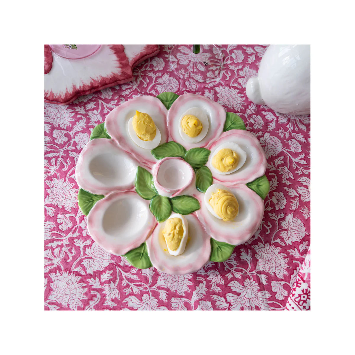  Featuring an elegant pink and white finish, this versatile tray is perfect for displaying dyed Easter eggs, serving deviled eggs, or creating a festive centerpiece. Its timeless design blends effortlessly with both classic and contemporary table settings, making it a delightful accent you'll reach for year after year.