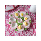  Featuring an elegant pink and white finish, this versatile tray is perfect for displaying dyed Easter eggs, serving deviled eggs, or creating a festive centerpiece. Its timeless design blends effortlessly with both classic and contemporary table settings, making it a delightful accent you'll reach for year after year.