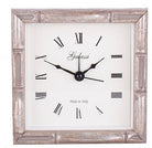 Square wall clock with metallic frame and Roman numeral markings, Galassi brand visible.