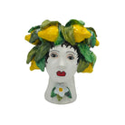  Blending classical artistry with the beauty of nature, this decorative vase serves as both a functional vessel and an eye-catching work of art. Whether filled with fresh blooms or displayed on its own, it adds distinctive character and Old World elegance to mantels, consoles, bookshelves, or dining tables. Its detailed craftsmanship and unique design make it a beautiful accent for traditional, European-inspired, or eclectic interiors.