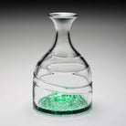 The William Yeoward Vanessa Carafe in Forest Green captures the effortless beauty of the Mediterranean with its rich, jewel-toned hue and handcrafted artistry. Expertly mouth-blown from fine crystal glass, each carafe is individually made by skilled artisans, ensuring that no two pieces are exactly alike. Its graceful silhouette and luminous Forest Green finish make it as striking on display as it is functional for serving water, wine, cocktails, or fresh juices.