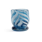 Bring warmth and artistry to your home with the Venezia Sea Blue Tealight / Votive Holder by Zodax. Expertly crafted from 100% soda lime glass, this elegant candle holder features rich, swirling colors that beautifully diffuse candlelight, creating a soft, inviting glow