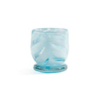 Bring warmth and artistry to your home with the Venezia Aqua Blue Tealight / Votive Holder by Zodax. Expertly crafted from 100% soda lime glass, this elegant candle holder features rich, swirling colors that beautifully diffuse candlelight, creating a soft, inviting glow