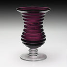 The Amethyst Ripples Vase combines beautiful color with a unique ripple effect on the body. A wonderful base in clear has a stacked button finish at the join. A really beautiful piece!