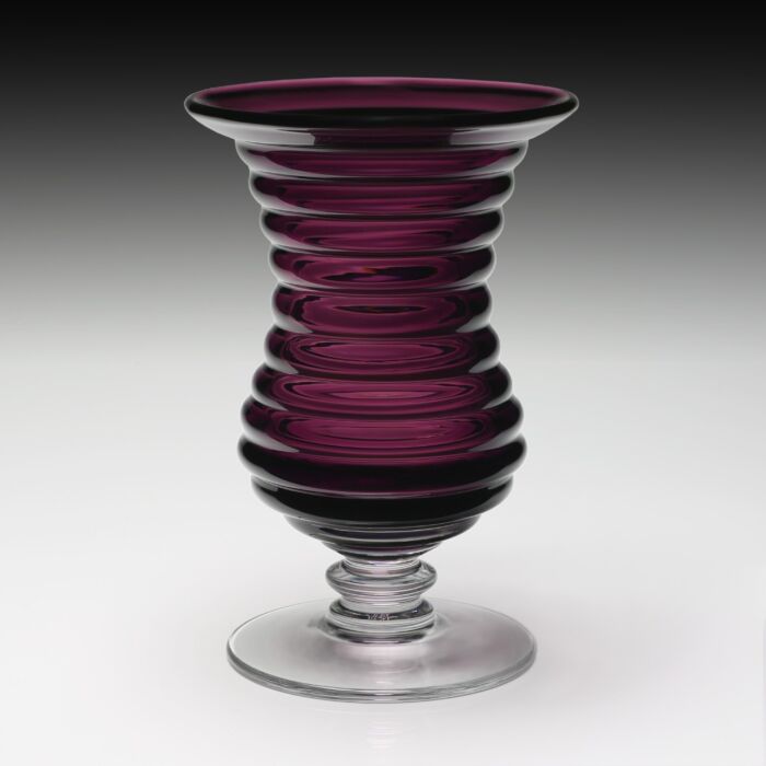 The Amethyst Ripples Vase combines beautiful color with a unique ripple effect on the body. A wonderful base in clear has a stacked button finish at the join. A really beautiful piece!