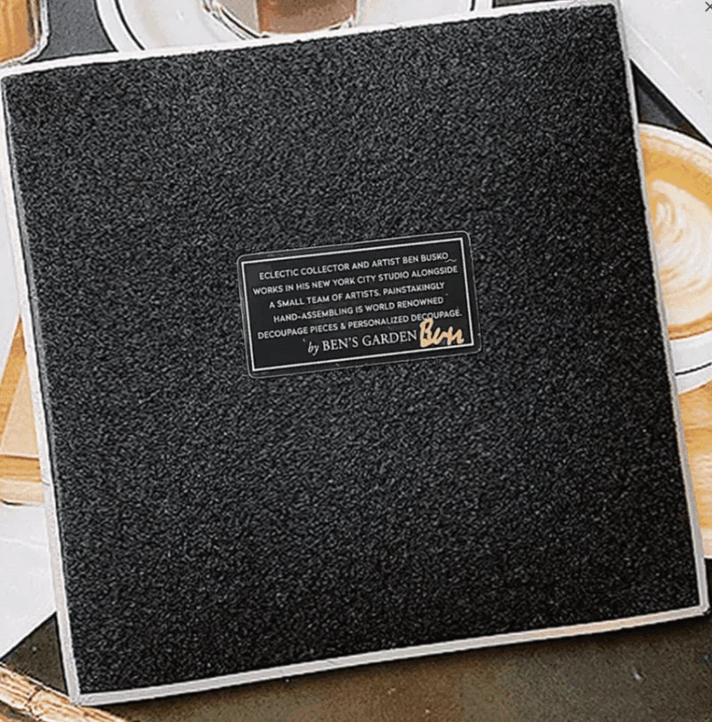 In the French tradition of decoupage, these bent-glass trays are handcrafted in our New York Studio. They feature vintage typeset on a natural cream background, and each is individually signed by Ben. Both practical and charming, Ben's signature decoupage is all food safe, wipe clean and the back side is felted.