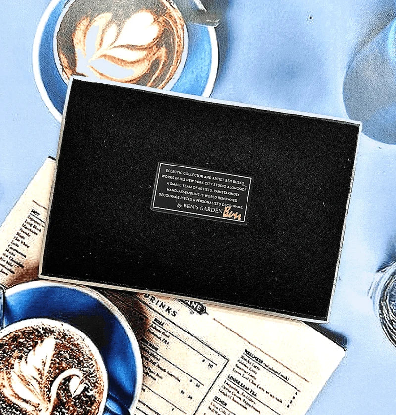 In the French tradition of decoupage, these bent-glass trays are handcrafted in our New York Studio. They feature vintage typeset on a natural cream background, and each is individually signed by Ben. Both practical and charming, Ben's signature decoupage is all food safe, wipe clean and the back side is felted.